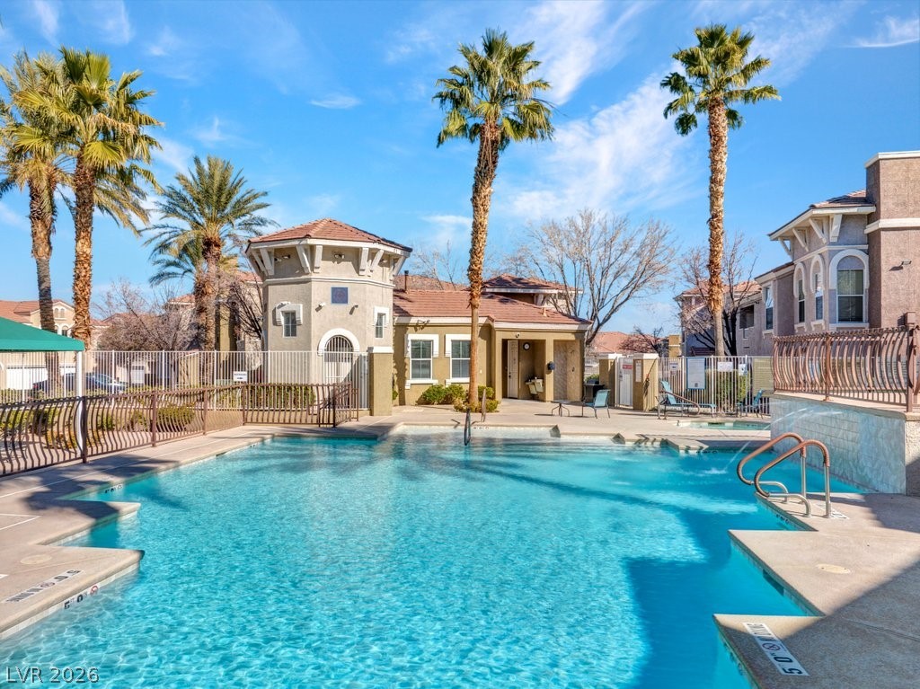 10001 Peace Way, Unit 2311 Las Vegas, NV 89147 - Photo 32 of 35 Community pool with a patio and a residential view