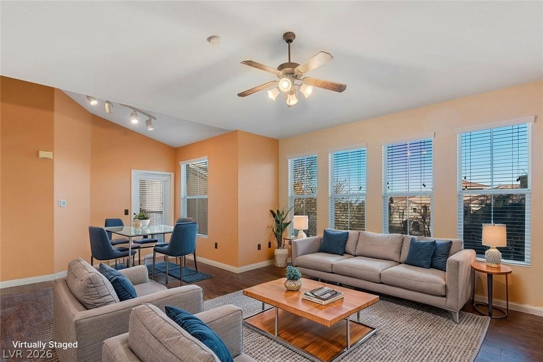 10001 Peace Way, Unit 2311 Las Vegas, NV 89147 - Photo 4 of 35 Living area featuring wood finished floors, ceiling fan, and lofted ceiling