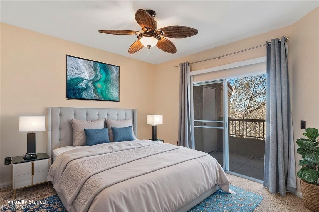 10001 Peace Way, Unit 2311 Las Vegas, NV 89147 - Photo 5 of 35 Carpeted bedroom with access to exterior and a ceiling fan