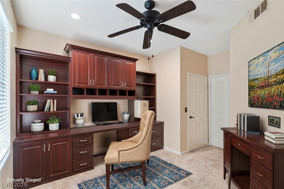 10001 Peace Way, Unit 2311 Las Vegas, NV 89147 - Photo 6 of 35 Office area featuring built in desk, ceiling fan, and light carpet