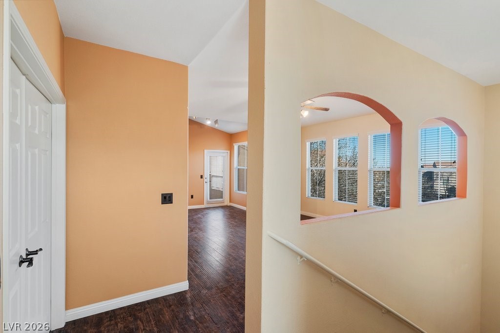 10001 Peace Way, Unit 2311 Las Vegas, NV 89147 - Photo 8 of 35 Corridor with dark wood-style floors and lofted ceiling
