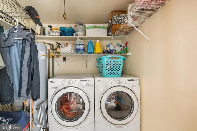 a view of a hallway with wooden floor and stairs