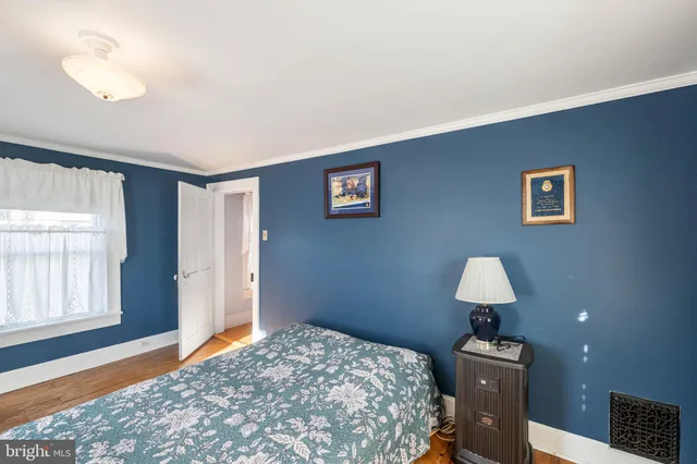 a bed room with a bed and a window