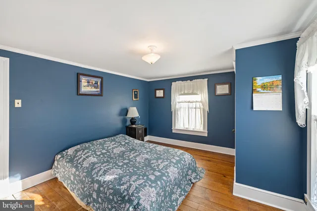 a bathroom with a granite countertop toilet and a shower curtain