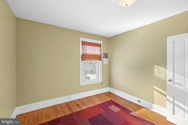 a view of a house with wooden fence