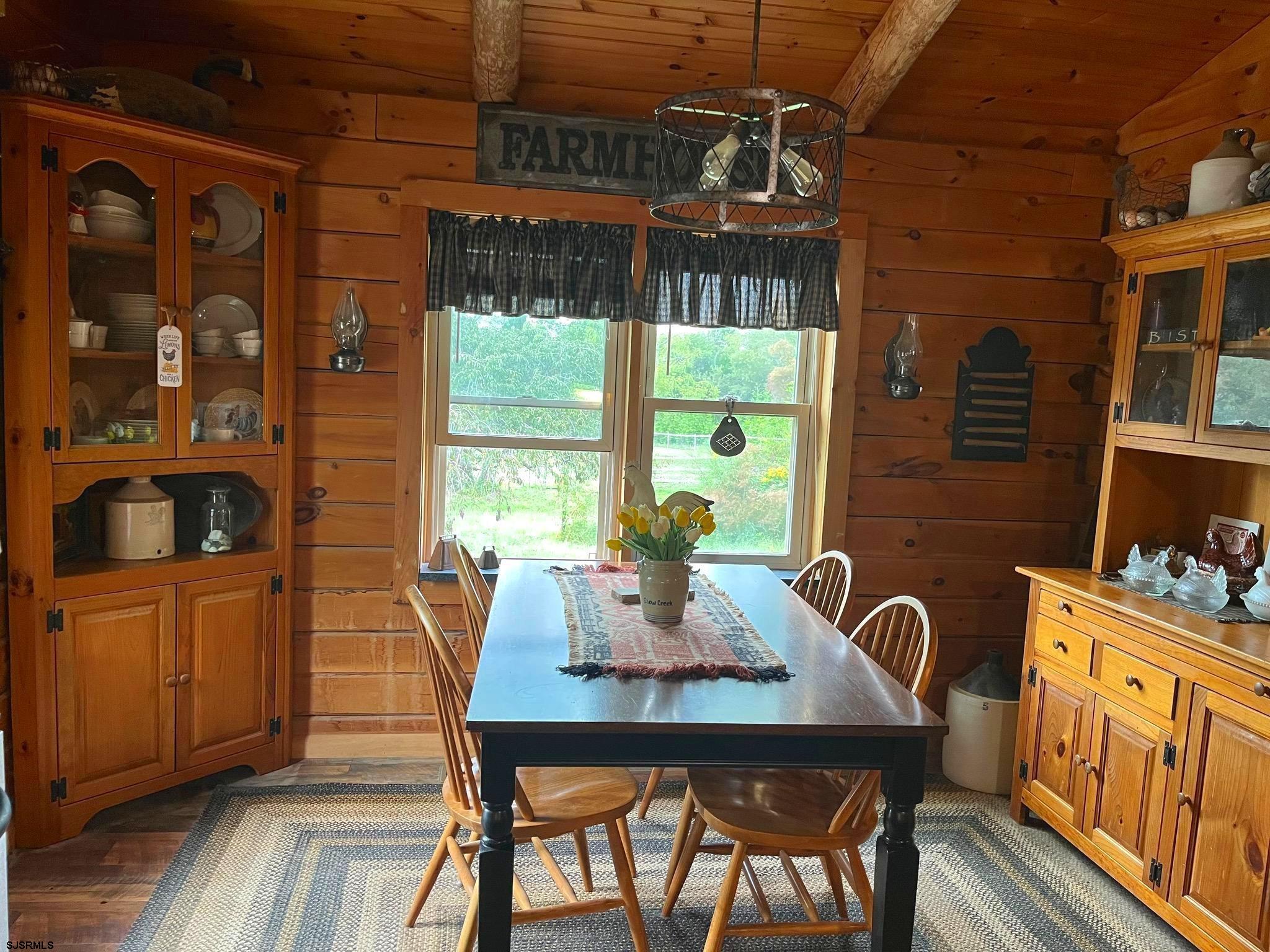 308 Willis Road Bridgeton, NJ 08302 - Photo 17 of 38 a dining room with furniture a chandelier and wooden floor