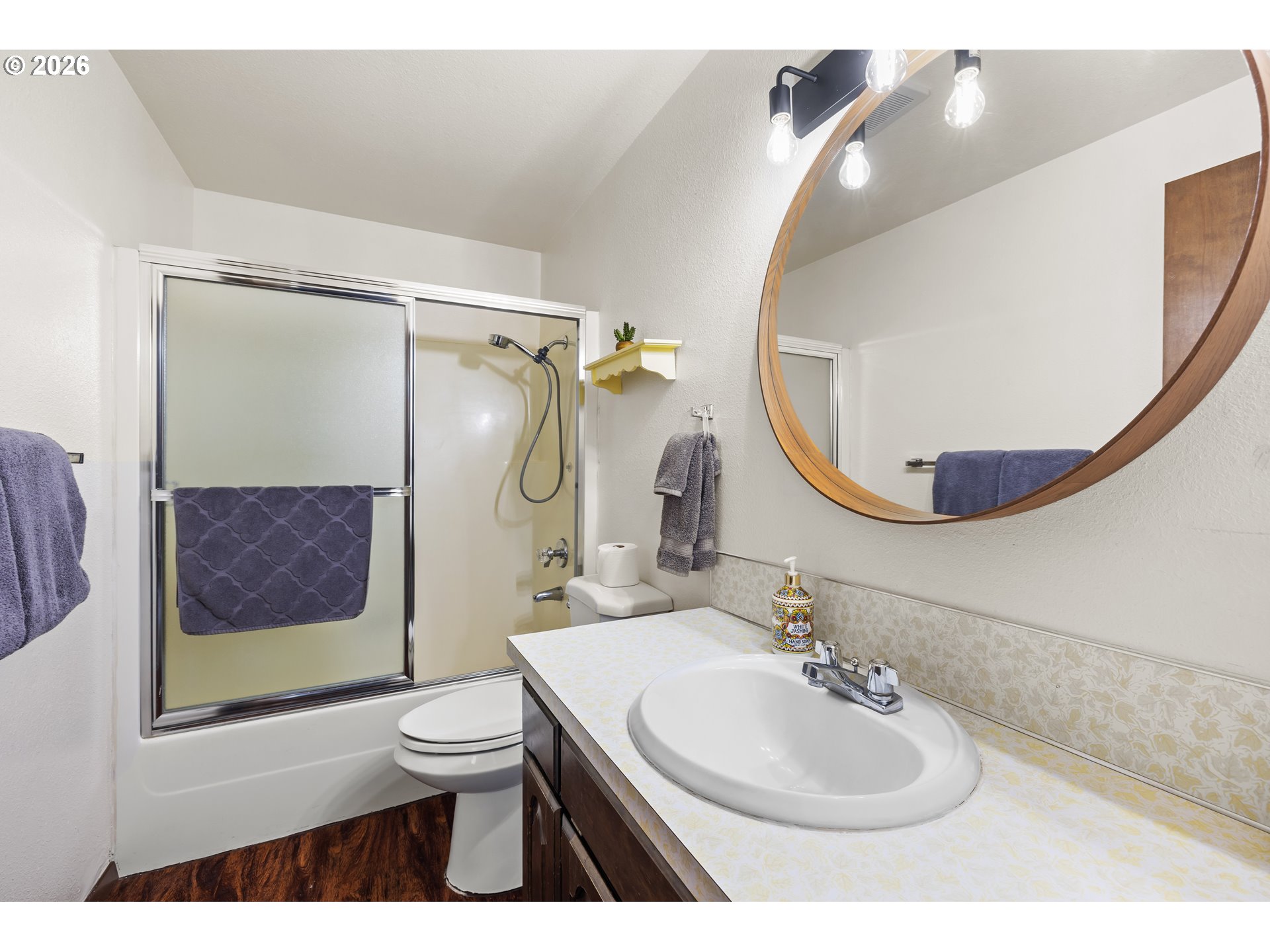 414 Monroe Street Umatilla, OR 97882 - Photo 11 of 19 a bathroom with a sink a toilet and a mirror