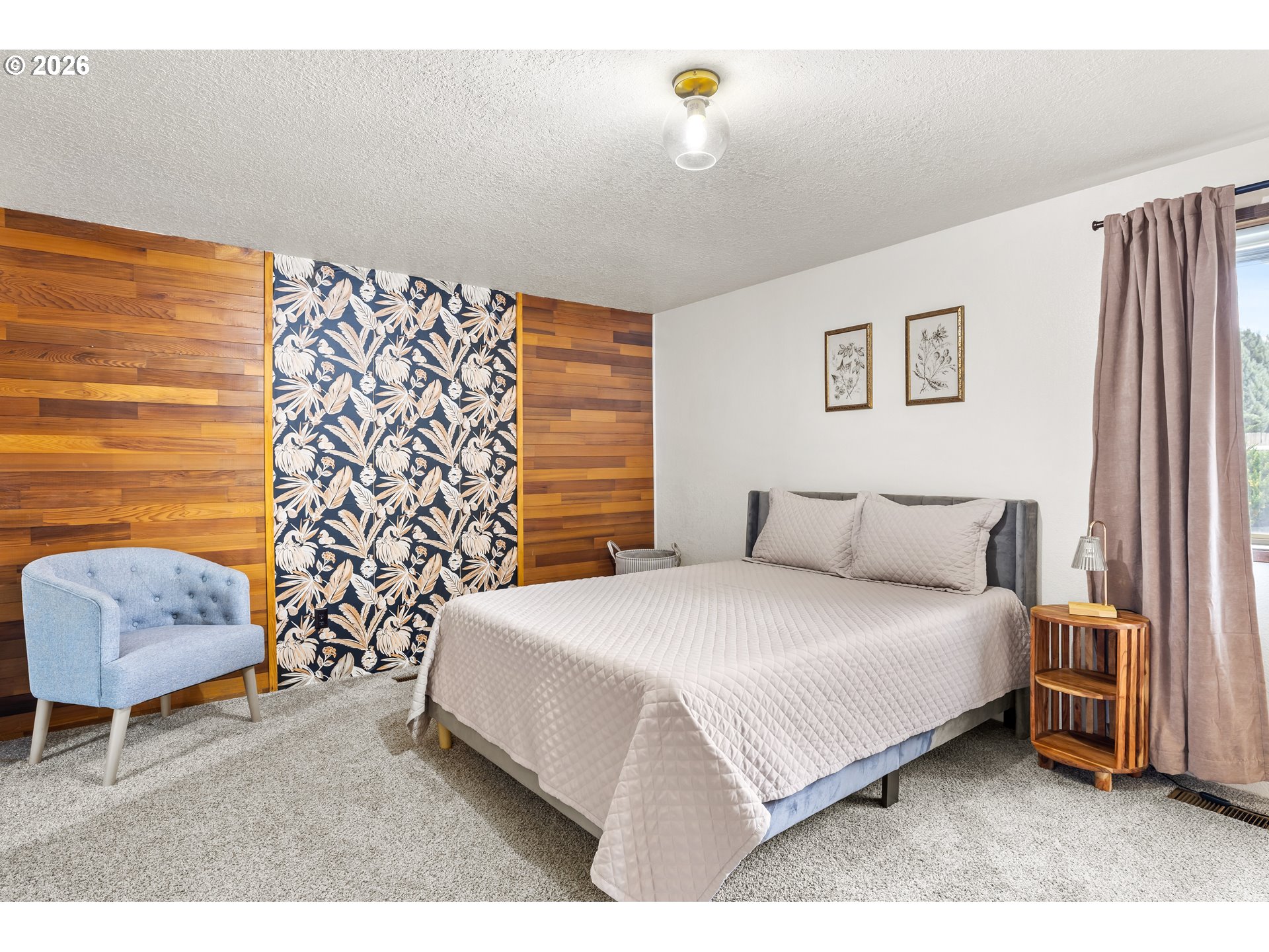 414 Monroe Street Umatilla, OR 97882 - Photo 13 of 19 a bedroom with a bed and a chair