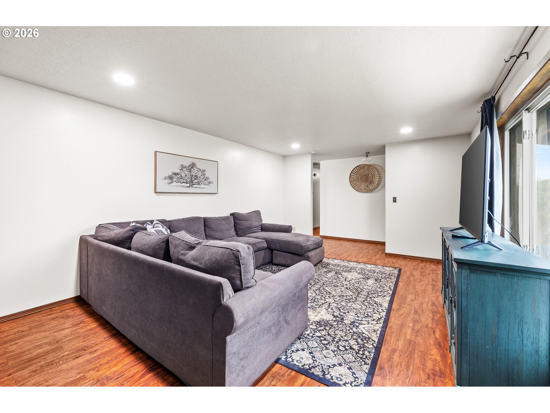 414 Monroe Street Umatilla, OR 97882 - Photo 4 of 19 a living room with furniture and a rug
