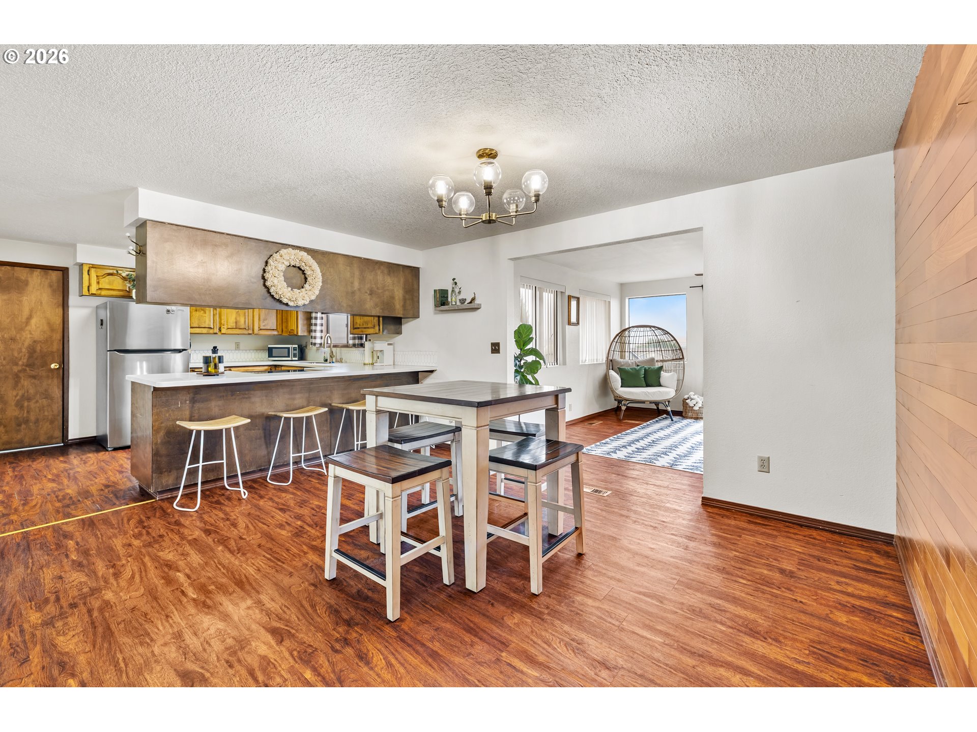 414 Monroe Street Umatilla, OR 97882 - Photo 5 of 19 a view of a dining room with furniture and wooden floor