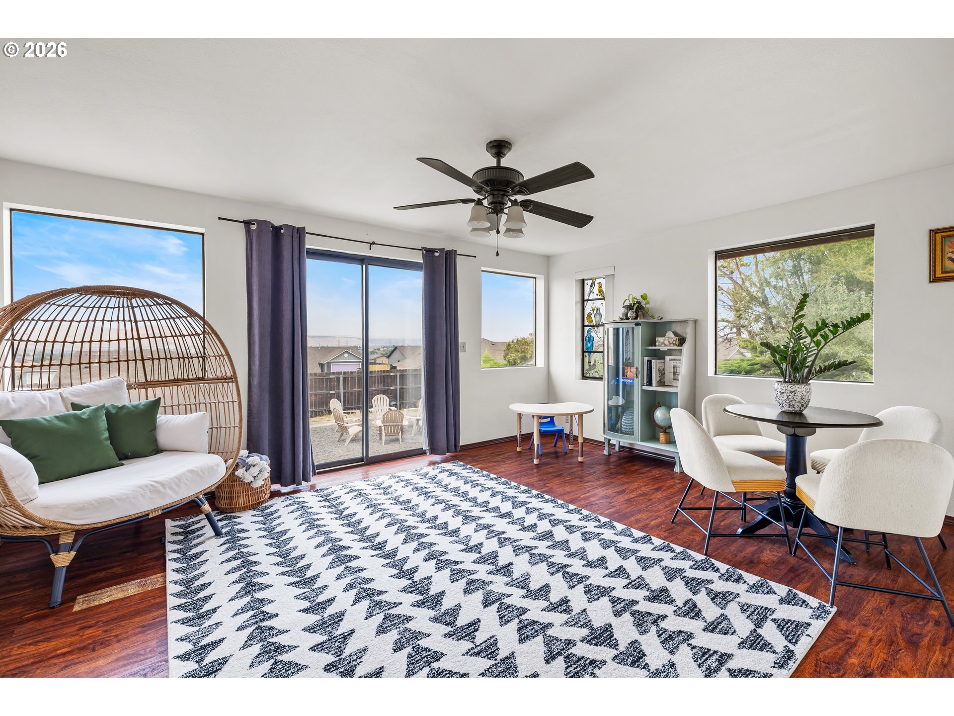 414 Monroe Street Umatilla, OR 97882 - Photo 9 of 19 a living room with furniture a rug and a large window