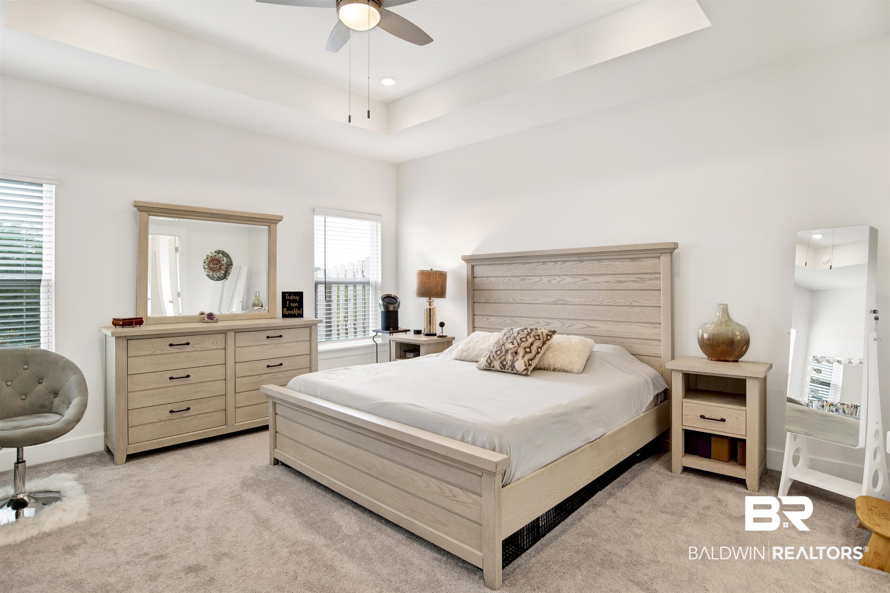 9894 Weller Cove Foley, AL 36535 - Photo 11 of 23 Bedroom featuring a tray ceiling, light colored carpet, recessed lighting, and ceiling fan