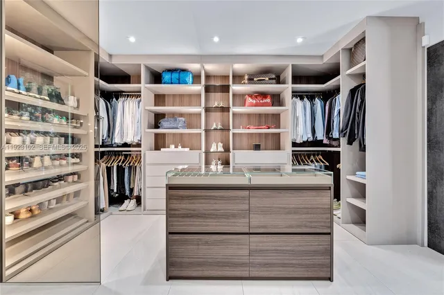 a room with a furniture and a book shelf