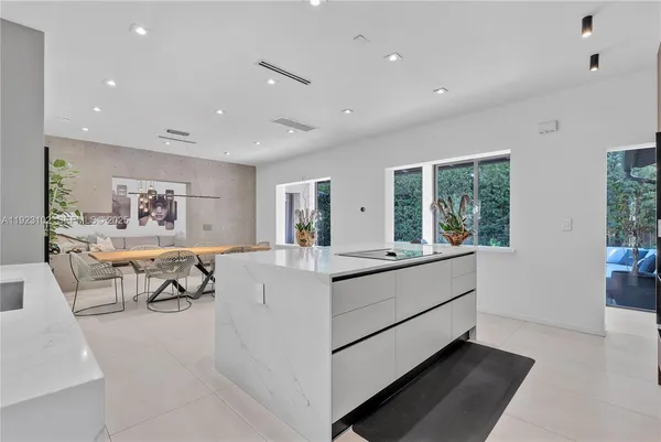 a kitchen with a table and chairs in it