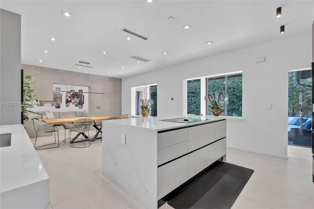 a kitchen with a table and chairs in it