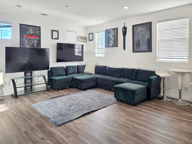 a kitchen with counter top space and wooden floor