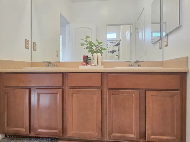 a white toilet sitting next to a shower curtain