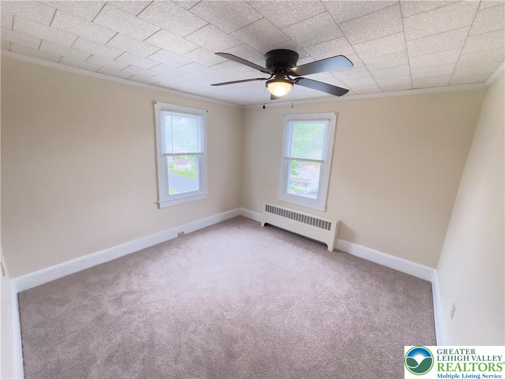 67 Long Run Road Lehighton, PA 18235 - Photo 13 of 23 en empty room with windows and ceiling fan