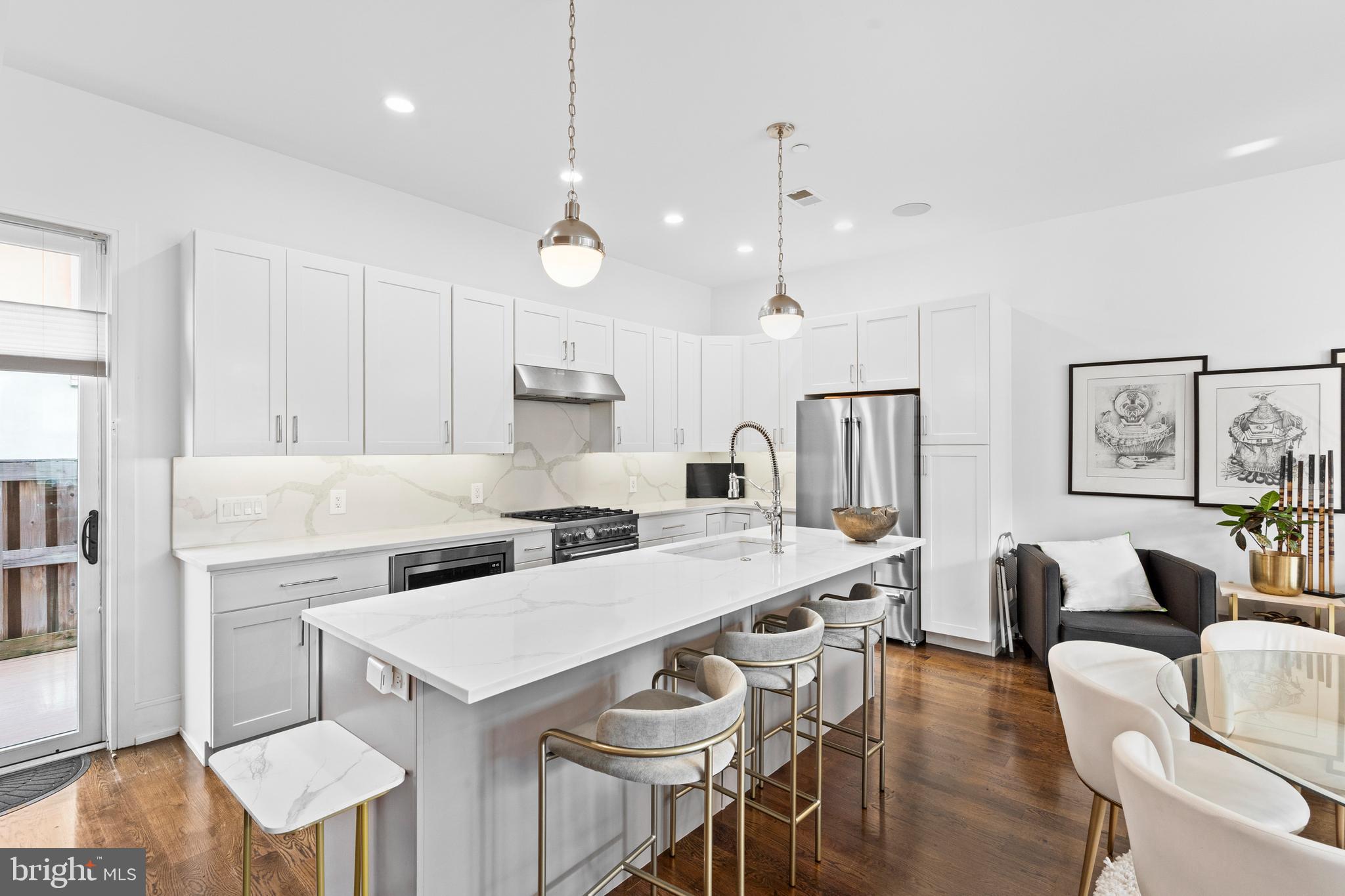 606 North 16th Street Philadelphia, PA 19130 - Photo 15 of 43 a large kitchen with a table and chairs