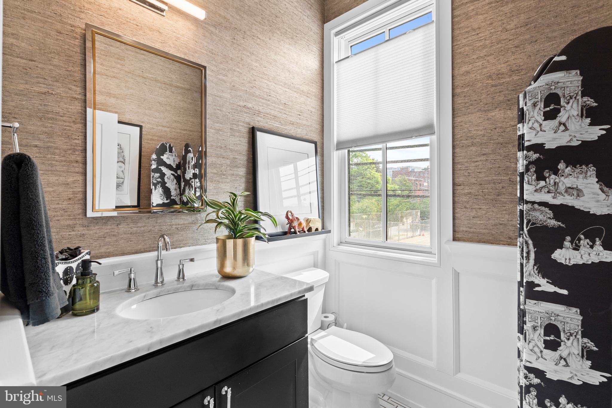 606 North 16th Street Philadelphia, PA 19130 - Photo 19 of 43 a bathroom with a granite countertop sink toilet and mirror