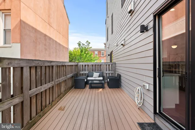 a view of balcony with deck and wooden floor