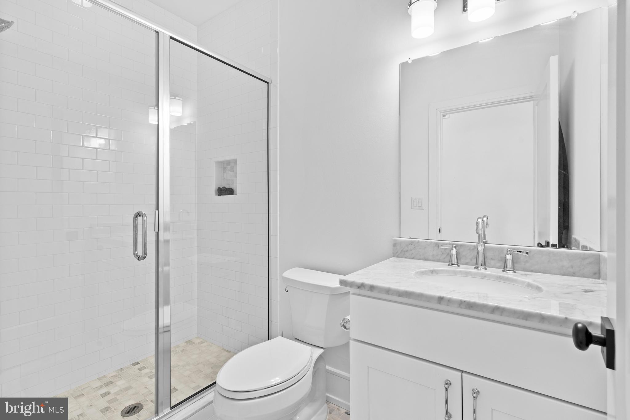 606 North 16th Street Philadelphia, PA 19130 - Photo 26 of 43 a bathroom with a sink toilet vanity and shower