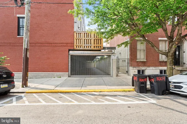 a view of a house with a large tree