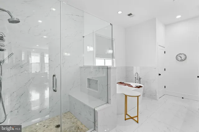 a bathroom with a shower and a sink