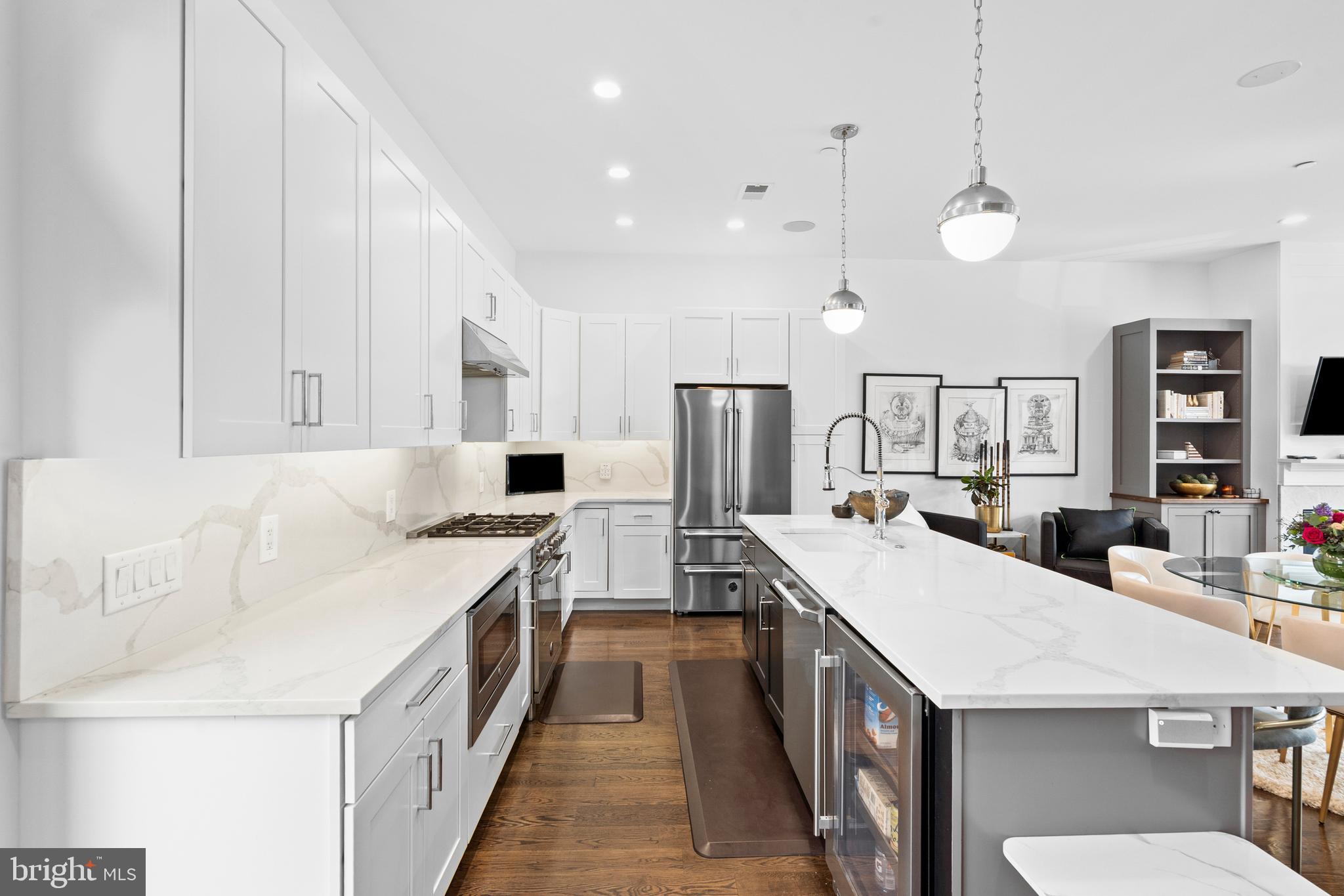 606 North 16th Street Philadelphia, PA 19130 - Photo 9 of 43 a large kitchen with a table and chairs