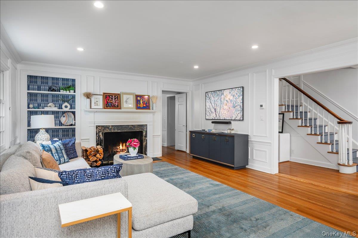 49 Eton Road Larchmont, NY 10538 - Photo 4 of 34 a living room with furniture and a fireplace