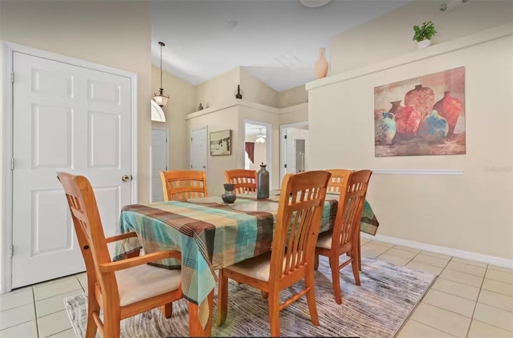 100 Cardinal Court Davenport, FL 33896 - Photo 9 of 30 a view of a dining room with furniture