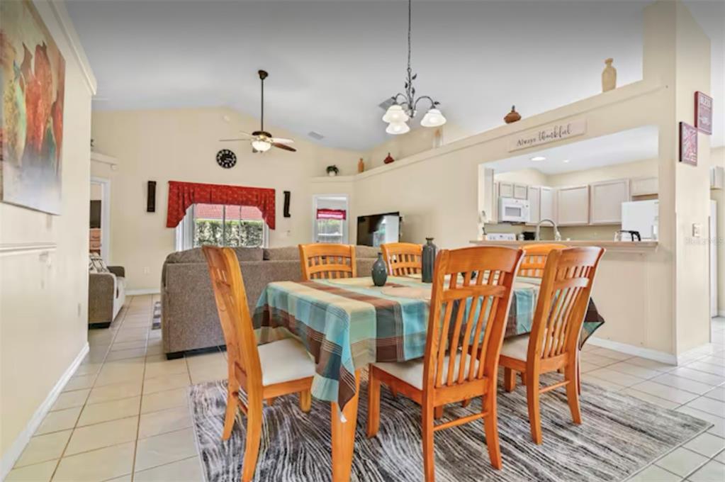 100 Cardinal Court Davenport, FL 33896 - Photo 10 of 30 a view of a dining room with furniture