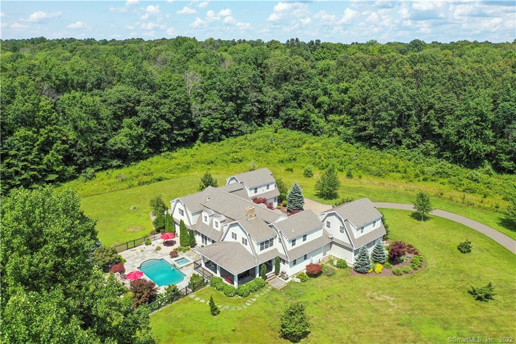92 Parker Hill Road Killingworth, CT 06419 - Photo 1 of 1 an aerial view of a house with swimming pool and garden
