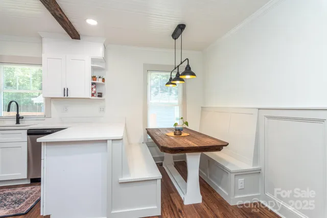 a view of kitchen island with furniture and wooden floor
