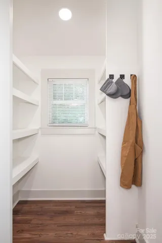 a view of a room with a bed and a window