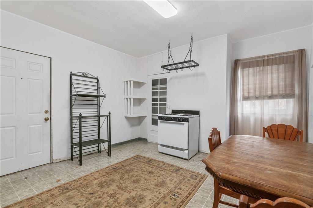 6824 Butler Street Pittsburgh, PA 15206 - Photo 11 of 26 a bedroom with furniture and a window