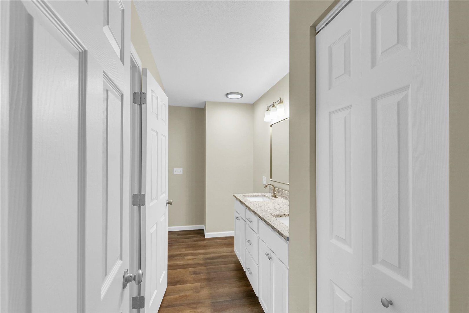 5 Montclair Road, Unit A Urbana, IL 61801 - Photo 25 of 33 a bathroom with a double vanity sink and mirror