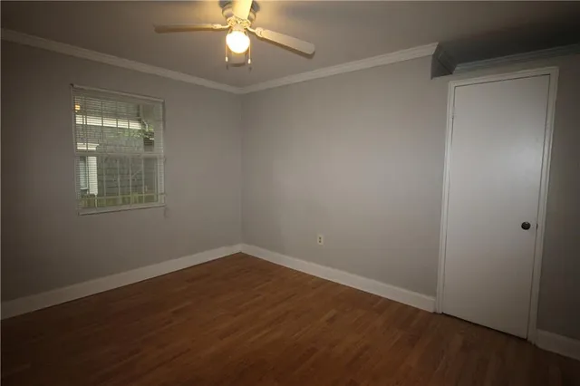 a white kitchen with sink and white cabinets