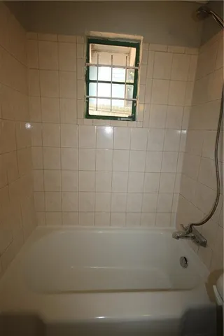 an empty room with a chandeliers