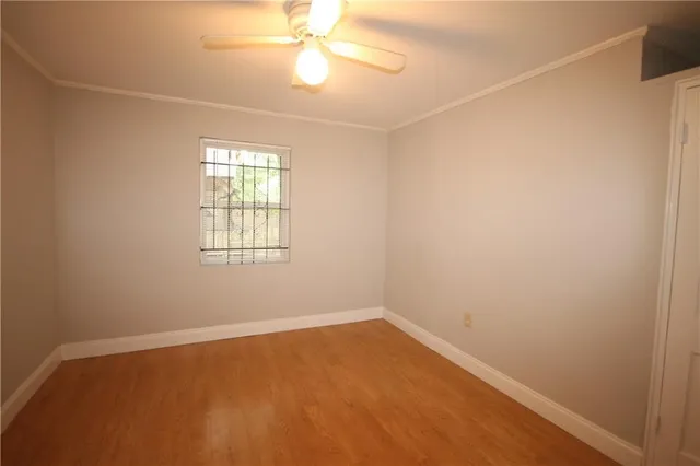 a white toilet sitting next to a bathroom sink and vanity