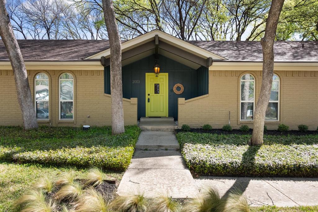 2003 Botts Drive Arlington, TX 76012 - Photo 2 of 40 a front view of a house with garden
