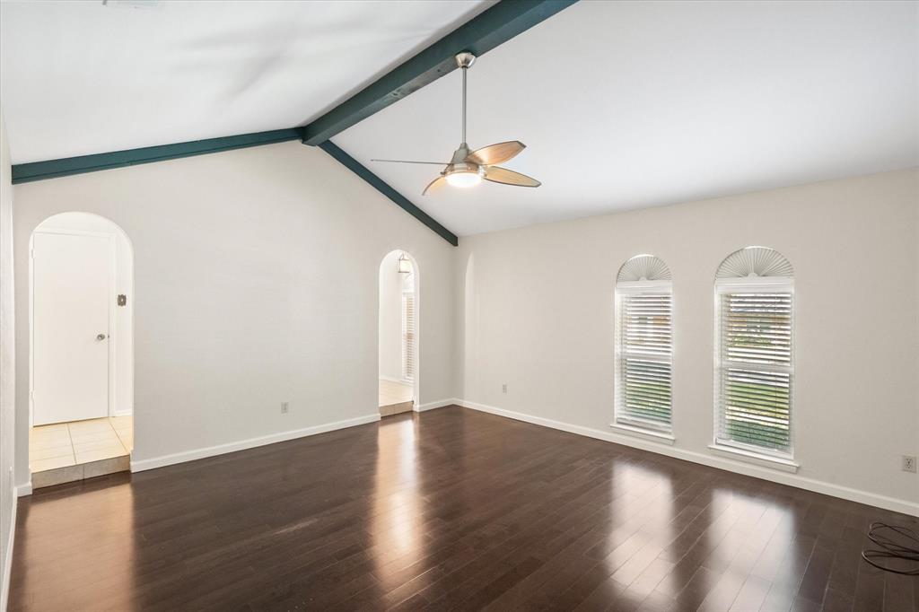 2003 Botts Drive Arlington, TX 76012 - Photo 22 of 40 an empty room with wooden floor and windows