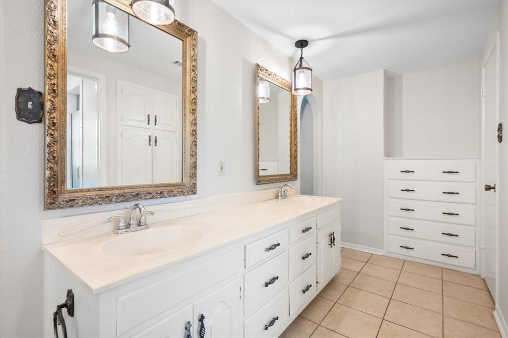 2003 Botts Drive Arlington, TX 76012 - Photo 24 of 40 a bathroom with a sink double vanity and a mirror