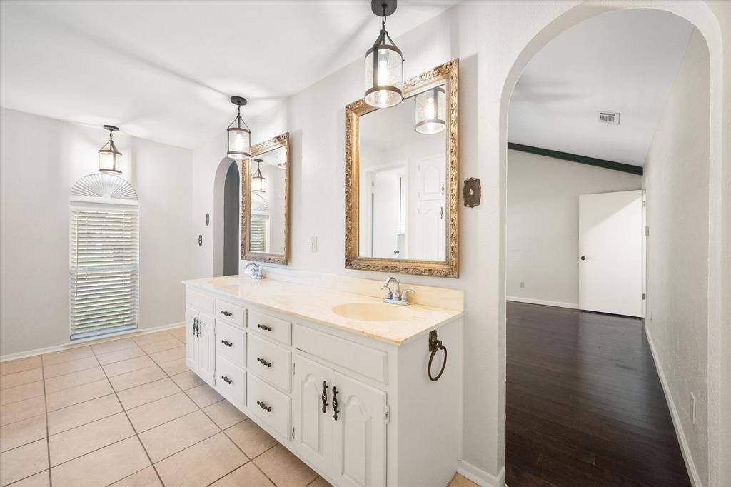 2003 Botts Drive Arlington, TX 76012 - Photo 25 of 40 a bathroom with a double vanity sink mirror and double