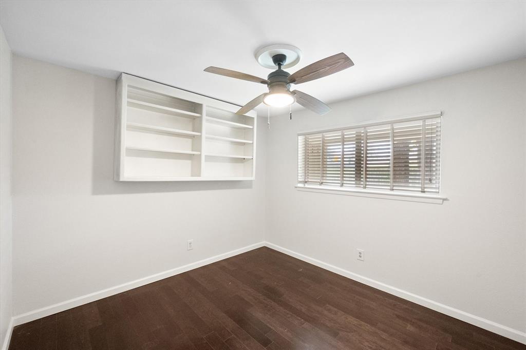 2003 Botts Drive Arlington, TX 76012 - Photo 33 of 40 a view of an empty room with wooden floor and a window
