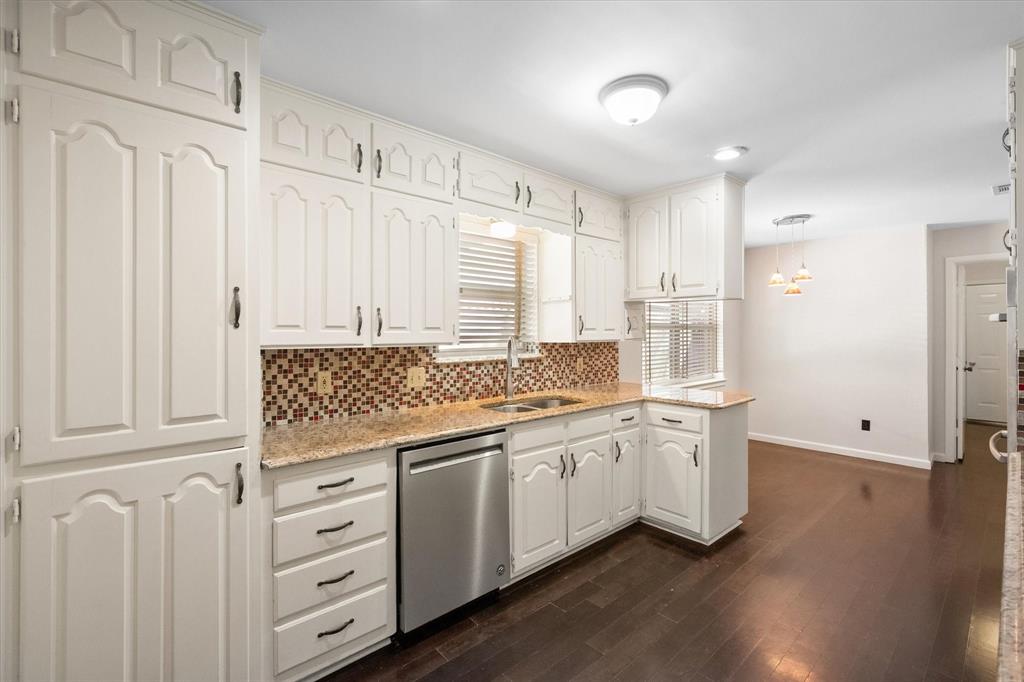 2003 Botts Drive Arlington, TX 76012 - Photo 8 of 40 a kitchen with white cabinets and sink