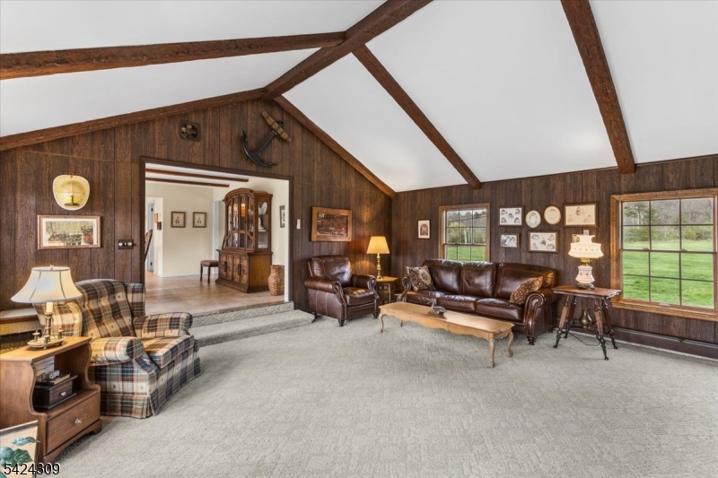 58 Andover Road Sparta, NJ 07871 - Photo 15 of 38 a living room with furniture and large windows