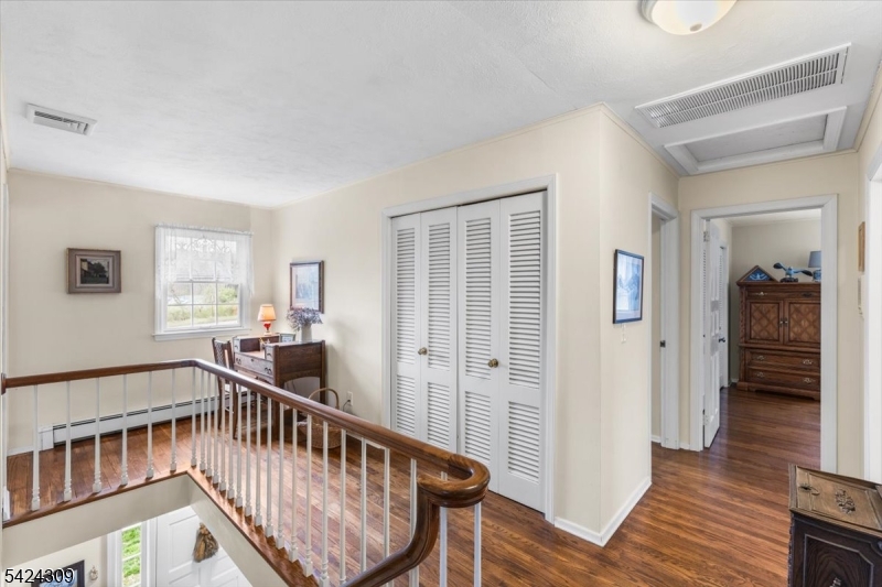 58 Andover Road Sparta, NJ 07871 - Photo 17 of 38 a view of an entryway wooden floor and a window