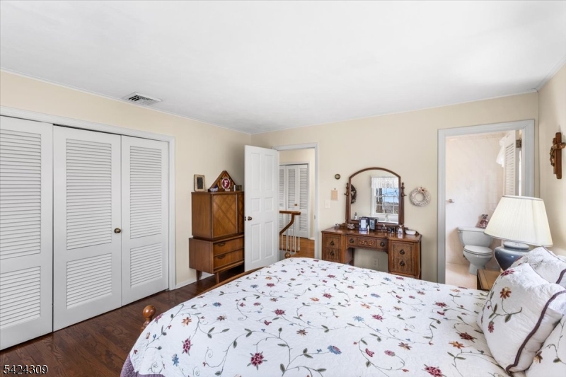 58 Andover Road Sparta, NJ 07871 - Photo 25 of 38 a bedroom with a bed and a dresser