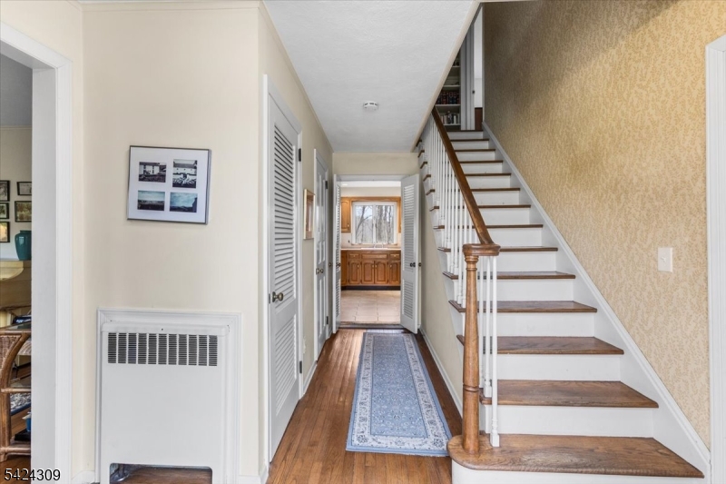 58 Andover Road Sparta, NJ 07871 - Photo 3 of 38 a view of a hallway with wooden floor and entryway